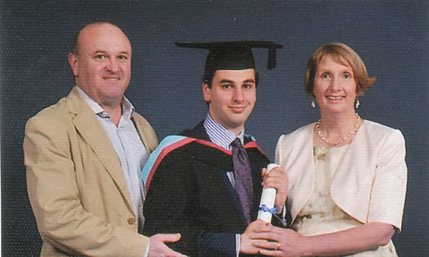 Elliott Johnson at his graduation from Nottingham University, with his parents, Ray and Alison [Image: Family Photo].