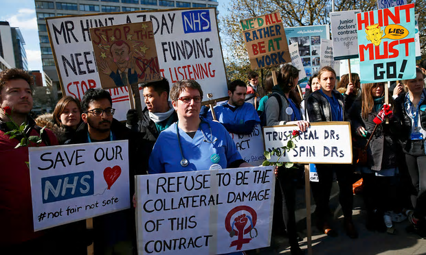 Junior doctors and supporters protest outside St Thomas’ hospital, London, in April [Image: Stefan Wermuth/Reuters].